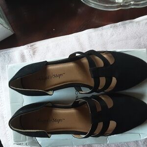 Black suede flat shoes.